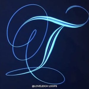 Flourished capital letter T in calligraphy
